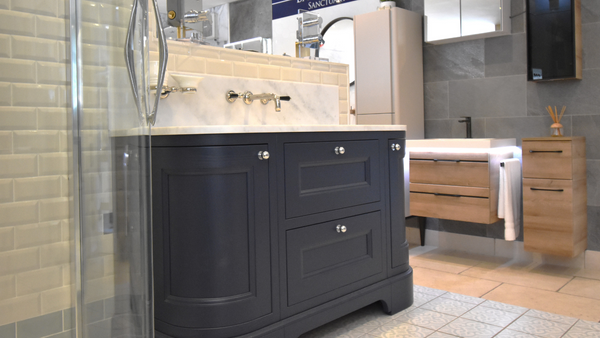 Burbidge tetbury curved vanity unit in Prussian blue with carrera white marble top showroom