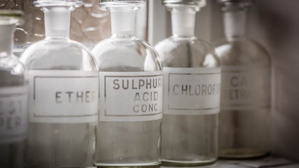 Apothecary bottles on cloakroom shelf