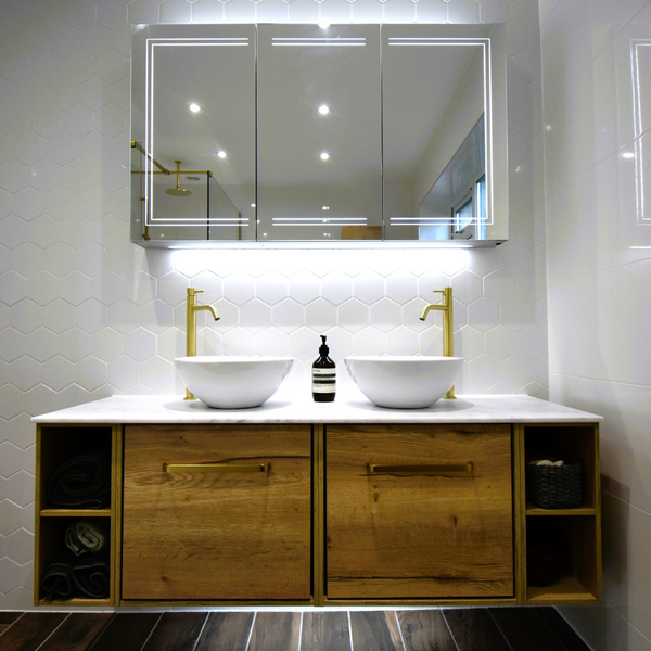 Infinity Windsor oak sink unit with open shelving and twin sinks with brushed brass tall basin mixer taps