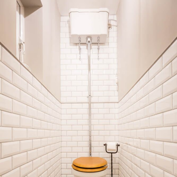Burlington cloakroom entrance with high level cistern WC and metro tiled walls