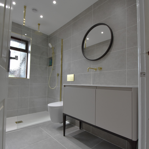 Hilton bathroom from door with walk-in-shower, sink vanity and wall hung wc