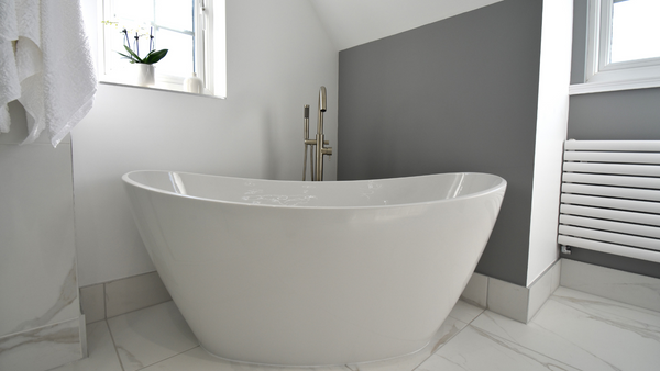 Water's freestanding Spa bath on Calacatta Porcelain large format tiles