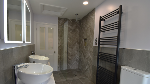 Twin bowls with his and hers tall basin taps and walk in shower