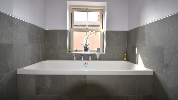 Carron Bath 1650MM X 750MM tiled in with Rock G in Grey