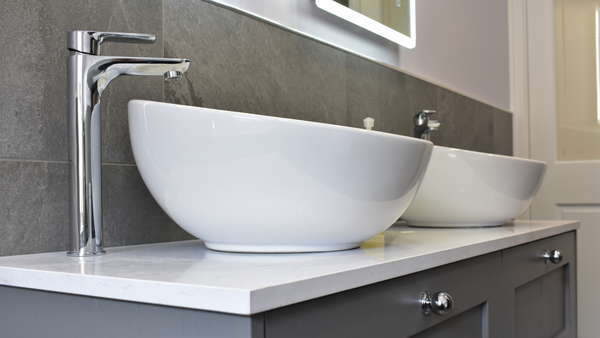 Twin round ceramic countertop basins with his and hers Bella tall basin tap
