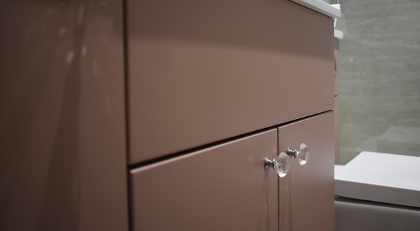 Avalon cabinetry in matt rose with crystal handle