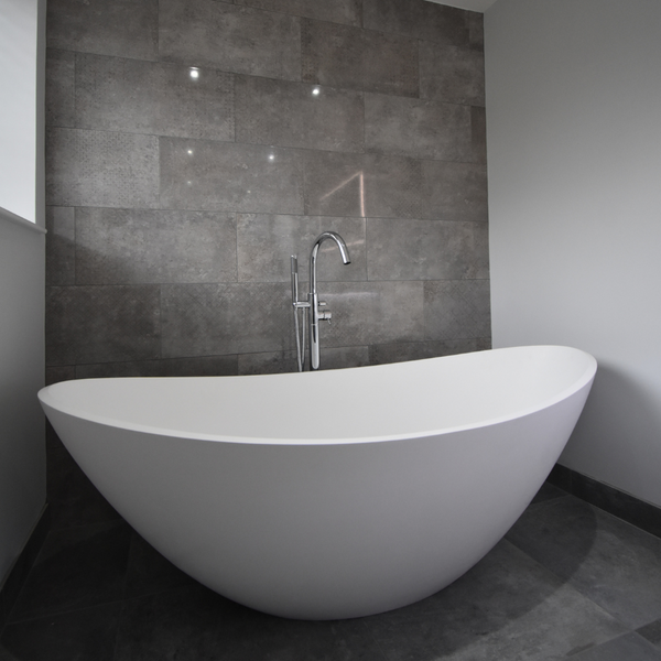 Waters freestanding breeze stone bath with freestanding tap over bath