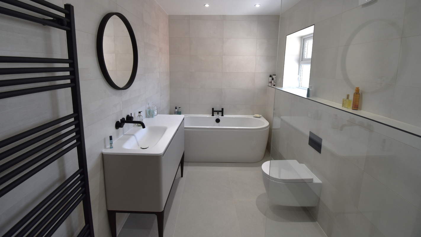 Modern bathroom installation featuring open-plan showering