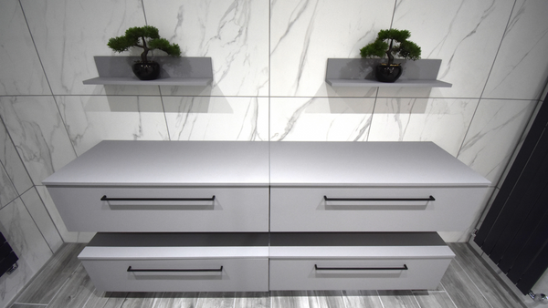 sanijura halo drawer units with carrera marble tiles to wall